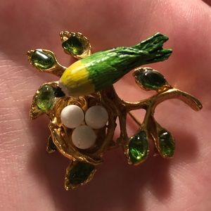 Vintage bird nest pin with green gems
